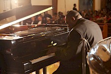 Robenson performs a piano solo.